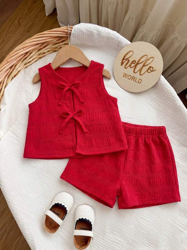 Conjunto de camiseta de tirantes y pantalones cortos de cintura elástica con decoración de lazo a rayas rosas para bebé niña