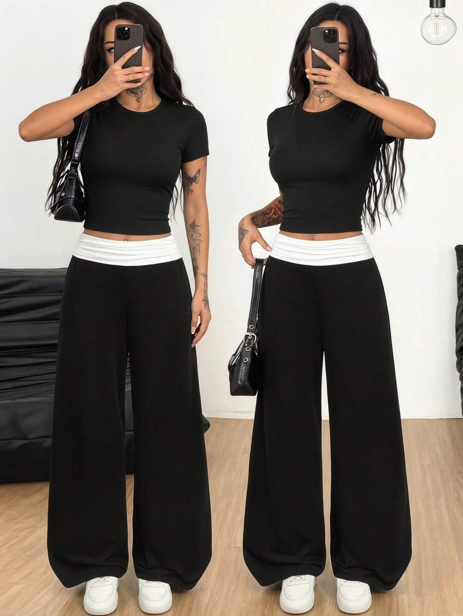 SHEIN Bộ đồ thể thao thường ngày dành cho nữ tuổi teen, áo thun cổ tròn tay ngắn và quần ống rộng phối màu tương phản, đen trắng. - màu đen - Xem 1