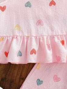 SHEIN Genkimix Kids Conjunto de verano para niñas de 4 a 7 años, estilo dulce y fresco, con top sin mangas con volantes y estampado de corazones de burbujas y arruga de agua, talla grande pantalón corto a juego estampado, de mezcla de algodón suave y ligera, adecuado para juegos al aire libre y uso diario casual en verano - Rosa - Ver 7