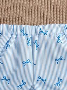 SHEIN Vintaside Kids 这款女童夏季粉白条纹露背吊带短裙套装，甜美俏皮，充满度假风情；采用梭织面料，版型合身。整套服装印满粉色小蝴蝶结和条纹图案，裙摆饰有荷叶边，活泼优雅。适合日常出行、上学、海滩度假、参加派对活动以及休闲放松等各种场合。 - 淺藍色 - 查看 6