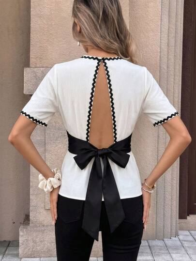 Pariaura Áo kiểu ngắn tay Gentle Breeze phối viền tương phản, khoét eo, thắt nơ sau lưng dành cho nữ.