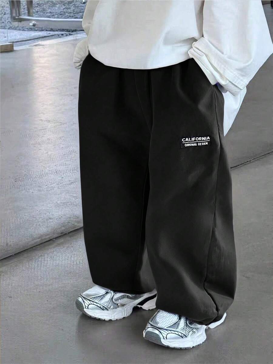 1条男童休闲韩版口袋抽绳腰带柔软舒适百搭长裤,适合日常穿着、上学、外出、运动、春秋季节穿着。 - 黑色 - 查看 1