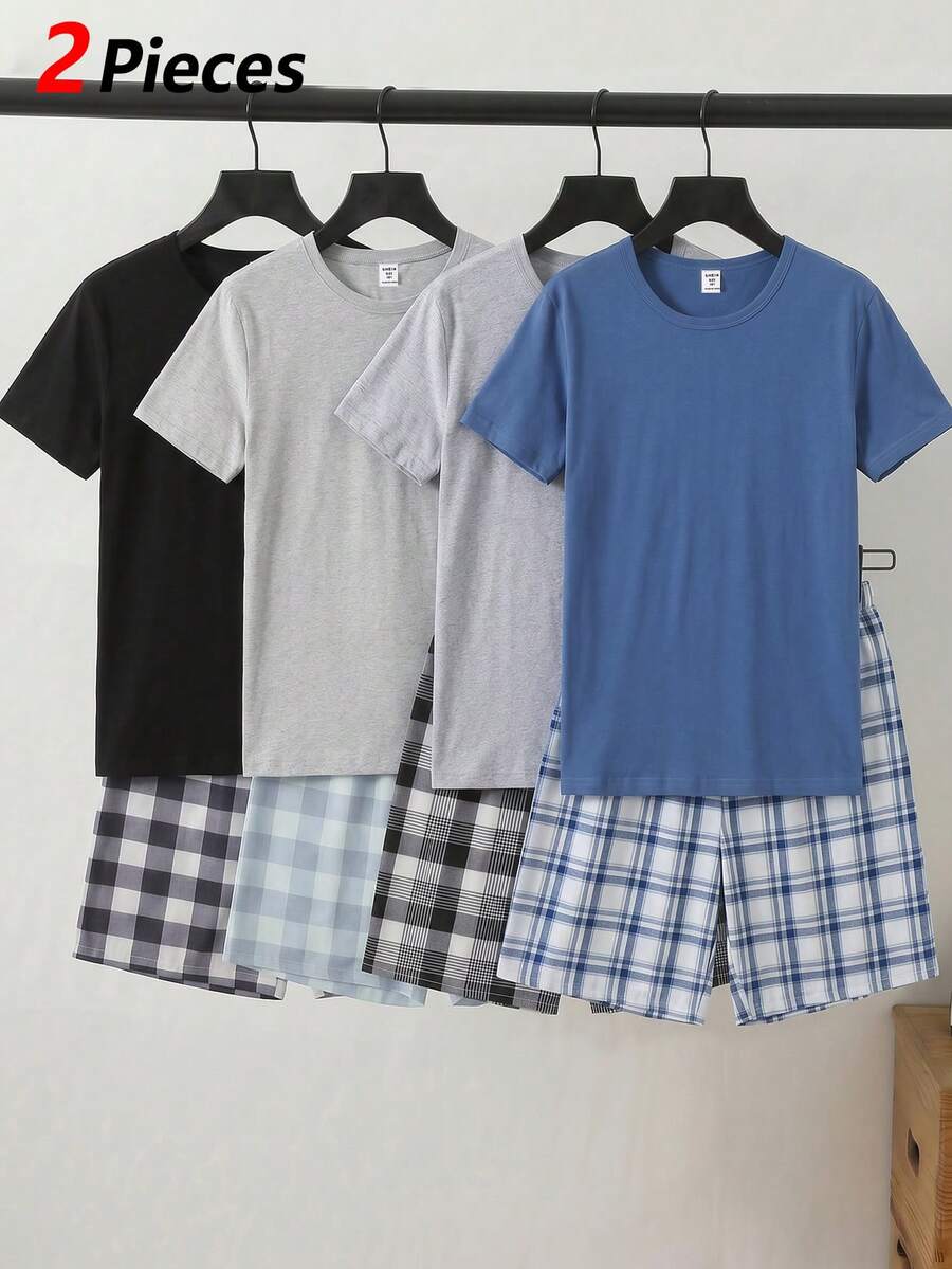 男童夏季休闲圆领睡衣套装，浅蓝色纯色短袖上衣搭配蓝白格子短裤，面料柔软透气，宽松版型，适合居家休闲和户外活动穿着。 - 藍色 - 查看 1