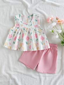 SHEIN Vintaside Kids 这款女婴春夏套装采用白色纯色提花面料，圆领无袖百褶裙式背心搭配彩色印花上衣，下身则为粉色弹力短裤，设计舒适简约。两件套风格休闲优雅，散发着法式乡村风情。宽松的版型适合日常外出、花园漫步、野餐、休闲放松以及参加派对等各种场合。 - 淺粉色 - 查看 5