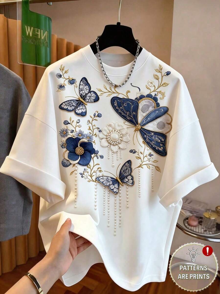 GlowEve Áo phông trắng nữ, áo phông thêu giả ngọc trai và in hình bướm, áo phông in hình hoa, áo phông cổ tròn nữ, áo phông tay ngắn nữ, áo phông mùa hè nữ, áo tay ngắn dáng rộng mới cho mùa hè, áo phông trắng in hình bướm thêu giả ngọc trai sang trọng, áo kiểu thời trang và tôn dáng, trang phục thường ngày thời trang nữ, trang phục đi làm và hẹn hò, thiết kế tinh tế, phong cách nhẹ nhàng và thanh lịch, sản phẩm bán chạy cao cấp, kiểu dáng cơ bản đa năng, phong cách công sở thời trang, phù hợp cho mặc hàng ngày, đi làm, hẹn hò, dự tiệc, thư giãn tại nhà, du lịch ngoài trời, trà chiều, kỳ nghỉ biển, dã ngoại và nhiều dịp khác. - trắng - Xem 1