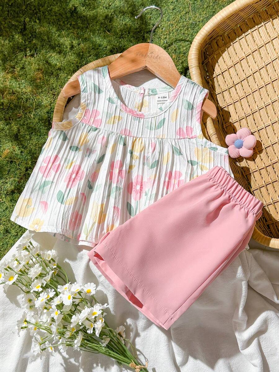 SHEIN Vintaside Kids 这款女婴春夏套装采用白色纯色提花面料,圆领无袖百褶裙式背心搭配彩色印花上衣,下身则为粉色弹力短裤,设计舒适简约。两件套风格休闲优雅,散发着法式乡村风情。宽松的版型适合日常外出、花园漫步、野餐、休闲放松以及参加派对等各种场合。 - 淺粉色 - 查看 1