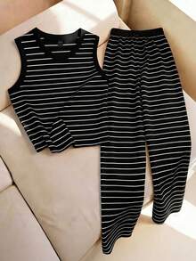 Conjunto de top sin mangas y pantalones de pierna ancha a rayas en blanco y negro, de tela suave y elástica, con un ajuste holgado.Estilo casual de vacaciones, adecuado para salidas de fin de semana, el Festival del Barco Dragón y otras festividades.Combínalo con un collar para un aspecto talla grande refinado. - Blanco y Negro 2 - Ver 3
