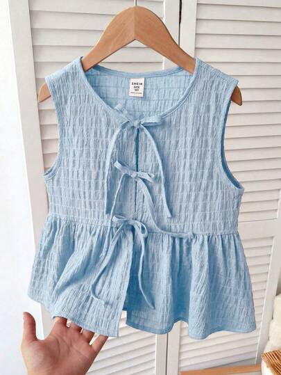 SHEIN Áo camisole nữ trẻ em/thiếu nữ màu xanh, vải voan jacquard vân nổi, không tay, dây vai thắt nơ, gấu bèo nhún, phong cách dễ thương, thường ngày, đi du lịch
