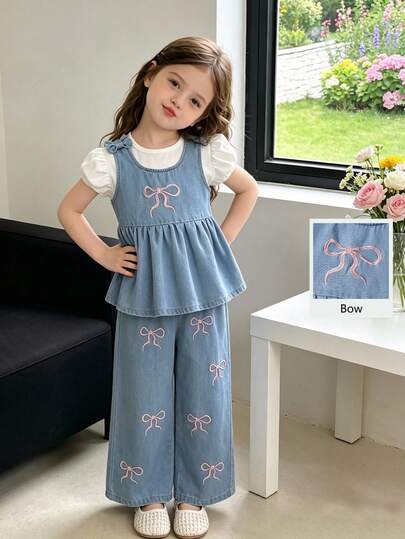SHEIN Bộ 2 món cho bé gái, gồm áo hai dây và quần jean ống rộng màu hồng nhạt, ôm sát, thêu nơ dễ thương. Chất liệu denim cotton mềm mại, nhẹ, là món đồ không thể thiếu cho các bé gái sành điệu, phù hợp cho mùa xuân/hè, mặc thường ngày, đi chơi, dự tiệc. Mẫu mới mùa xuân/hè 2026.
