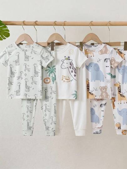 SHEIN Set de 3 piezas de pijama con diseño de dibujos animados de animales lindos, de ajuste ceñido y cómodo, con top de manga corta y cuello redondo, y pantalones, para niños. Compra 2 y llévate 1 gratis, apto para todas las estaciones.