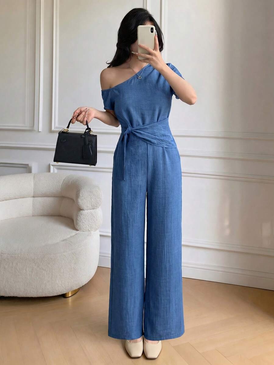 Celisse Bộ jumpsuit ren nữ, thiết kế bất đối xứng vai, thắt eo, thanh lịch và tinh tế, thích hợp cho mùa xuân/hè. - Màu xanh lam - Xem 1