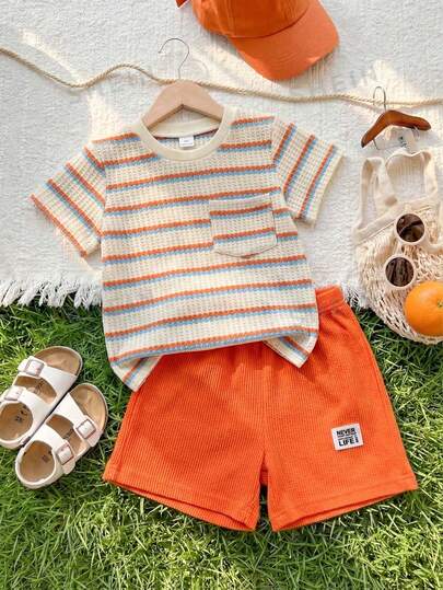 SHEIN Playful Pals Young Boy Summer Casual Vacation & Daily Commute Waffle Fabric Colorblock Striped Print Patchwork Pocket Short Sleeve T-Shirt And Neon Orange Shorts Set