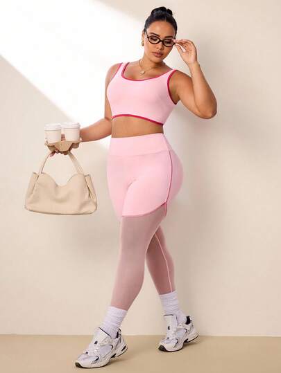 SHEIN Rhythm Era Bộ đồ thể thao cỡ lớn dành cho nữ gồm áo tank top ngắn và quần legging.