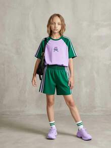 SHEIN Bộ đồ 2 mảnh Casuvi Kids dành cho bé gái: Áo thun dệt kim kết hợp với quần short dệt kim kiểu dáng thường ngày, họa tiết nơ hoạt hình, sọc bên hông tương phản, phong cách thường ngày kiểu Mỹ, phù hợp cho trang phục hàng ngày và kỳ nghỉ xuân/hè. - Màu Lilac Tím - Xem 1