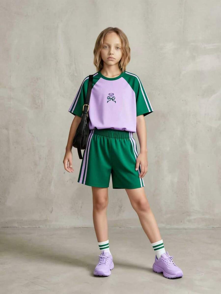 SHEIN Bộ đồ 2 mảnh Casuvi Kids dành cho bé gái: Áo thun dệt kim kết hợp với quần short dệt kim kiểu dáng thường ngày, họa tiết nơ hoạt hình, sọc bên hông tương phản, phong cách thường ngày kiểu Mỹ, phù hợp cho trang phục hàng ngày và kỳ nghỉ xuân/hè. - Màu Lilac Tím - Xem 1