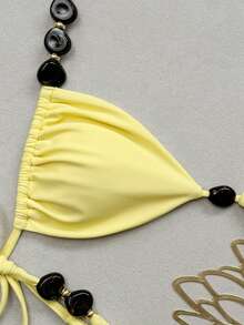 Bonvoyette Bộ bikini hai mảnh màu vàng chanh, dây buộc cổ tam giác và hạt nhựa màu nâu không đều, kiểu dáng gợi cảm, buộc dây bên hông, thích hợp cho kỳ nghỉ của phụ nữ. - Màu vàng - Xem 3