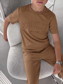 SHEIN 2pcs/Set Tween Boys' Brown Summer Casual City Break College Style Big Letter Embossed Graphic Round Neck Short Sleeve T-Shirt And Pants Sports Set - Coffee Brown - View 5