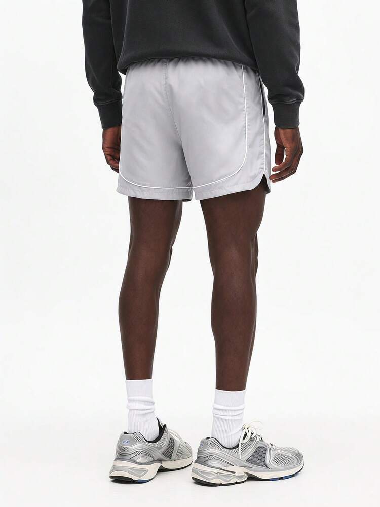 Drawstring Shorts With Curved Hem And Logo Detail For Casual Summer Wear