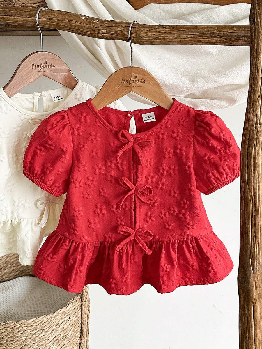 SHEIN Vintaside Kids 女婴衬衫，采用独特的印花面料，乡村度假风格，可爱时尚，适合春夏穿着，带有蝴蝶结装饰。