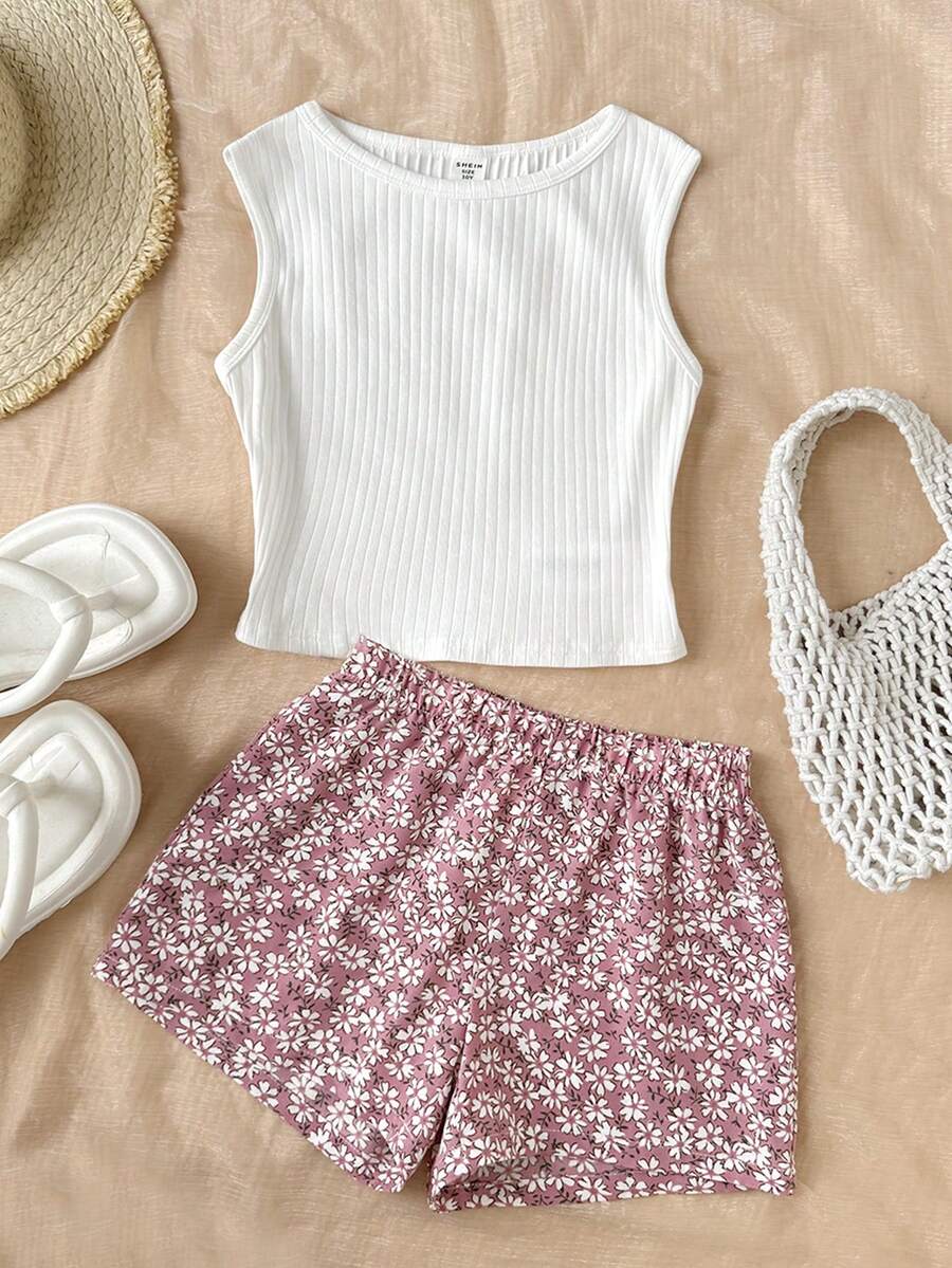 SHEIN Bộ 2 món cho bé gái tuổi teen: áo vest cổ chéo sọc màu trơn và chân váy bánh kem cạp cao họa tiết hoa, phong cách dễ thương độc đáo, phù hợp đi du lịch, lễ hội âm nhạc, tựu trường, tiệc trưa và trà chiều sân vườn mùa xuân - Nhiều màu - Xem 1