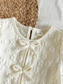 SHEIN Vintaside Kids 女婴衬衫，采用独特的印花面料，乡村度假风格，可爱时尚，适合春夏穿着，饰有蝴蝶结。 - 杏色 - 查看 7
