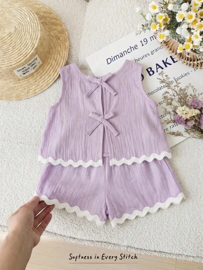 Cozy Pixies Bộ 2 món cho bé gái, áo cổ tròn màu trơn có nơ sau lưng và quần short, màu tím, chất liệu dệt, màu hoa oải hương, viền bèo nhún, dây rút, thoải mái, thời trang, đa năng, mềm mại, phù hợp cho mặc hàng ngày, đi học, đi chơi, chơi thể thao, mùa xuân/hè.