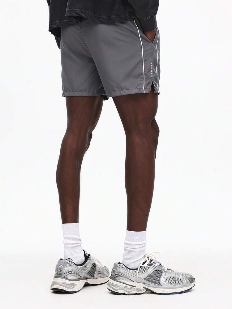 Side Piping Detail Regular Fit Mid-Thigh Shorts With Side Split Hem And Vertical Logo Print