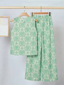 SHEIN Bộ đồ đi nghỉ mát 2 món cho bé gái tuổi teen: áo không tay cổ tròn dáng rộng màu hồng in hoa và quần ống rộng. - Nhiều màu - Xem 4