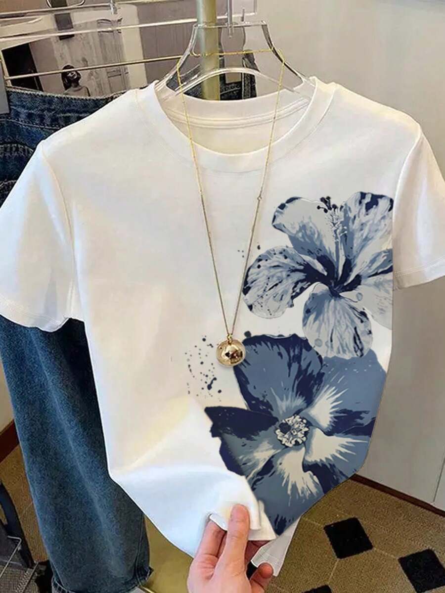 INAWLY 大码女式短袖T恤，水彩花卉印花，休闲百搭的圆领宽松上衣，尽显夏日度假风情。艺术感十足的修身基础款T恤，适合日常通勤和约会等场合。短袖设计清新淡雅，彰显年轻活力，舒适透气的剪裁在韩国广受欢迎。简约时尚的T恤，日常出行必备，也是送给女友和母亲节的理想礼物。 - 白色 - 查看 1