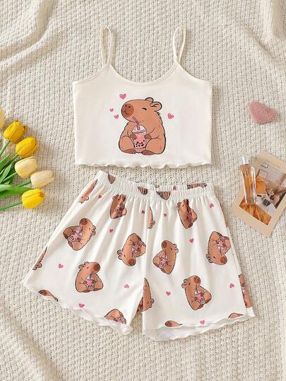 SHEIN Bộ đồ ngủ cho bé gái tuổi teen, gồm áo hai dây và quần short in hình hoạt hình, thích hợp cho mùa thu, mùa đông và mọi mùa.