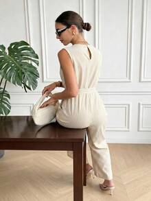 Franclia Bộ jumpsuit nữ cổ chữ V không tay, có túi, cài cúc đôi, xếp ly, ống rộng, thời trang mùa hè. - Màu be - Xem 6