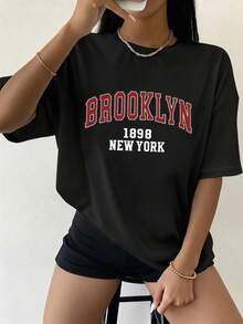 Camiseta de mujer para otoño-invierno, de manga corta con cuello redondo, ideal como prenda básica. Con diseño holgado y estampado moderno - Negro - Ver 2