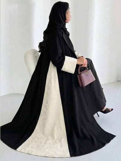 Al Najma Áo choàng Abaya Ả Rập trang nhã với họa tiết jacquard dập nổi và màu trơn, phù hợp cho các dịp trang trọng.