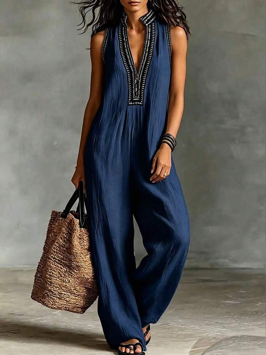 SHEIN Holidaya Bộ jumpsuit không tay mới dành cho nữ, màu be, với họa tiết hoa và thiết kế ống rộng, phong cách boho chic, thích hợp cho kỳ nghỉ biển, dạo chợ, chất liệu thoải mái và thanh lịch, đa năng cho các hoạt động hàng ngày và những chuyến đi ngắn ngày. - Màu xanh hải quân - Xem 1