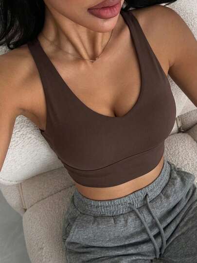DAZY Áo bra thể thao không tay dáng ngắn, màu trơn, kiểu dây chéo sau lưng, có đệm mút dành cho nữ.