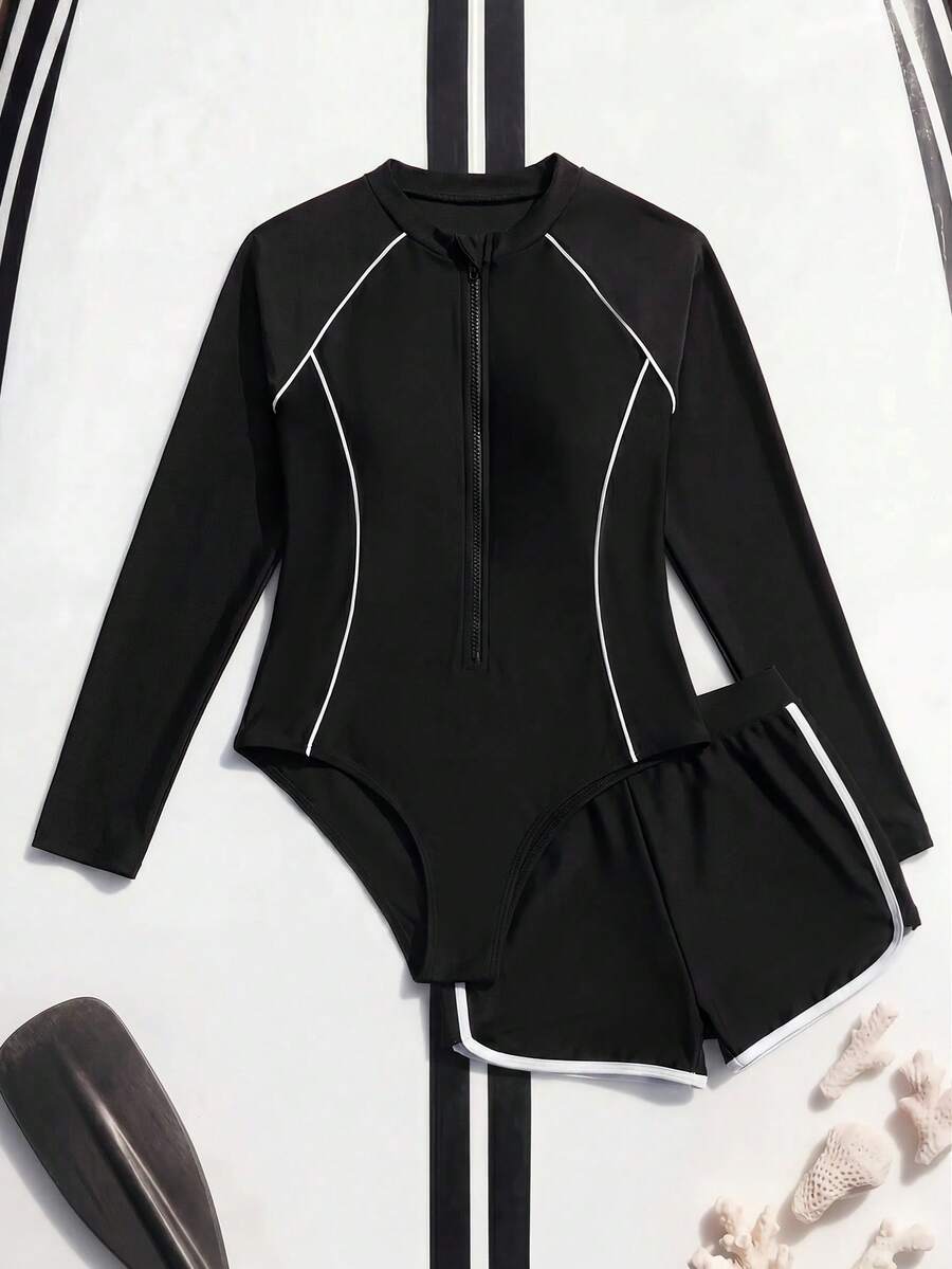 SHEIN Conjunto de Traje de Baño para Niñas Preadolescentes Nueva Moda, Estampado de Patchwork, Estampado Botánico Tropical, Bikini para Niñas con Camiseta de Protección Solar de Manga Larga, Traje de Baño de 2 Piezas con Camiseta de Protección Solar de Manga Larga y Pantalones Cortos con Cremallera para Niñas Preadolescentes, Conjunto de Traje de Baño Modesto para Niñas Preadolescentes, Ropa de Resort para Niñas con Camiseta de Protección Solar de Manga Larga y Pantalones Cortos - Negro - Ver 1