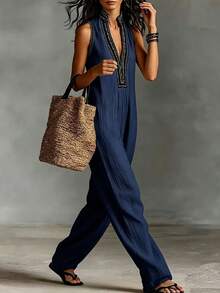 SHEIN Holidaya Bộ jumpsuit không tay mới dành cho nữ, màu be, với họa tiết hoa và thiết kế ống rộng, phong cách boho chic, thích hợp cho kỳ nghỉ biển, dạo chợ, chất liệu thoải mái và thanh lịch, đa năng cho các hoạt động hàng ngày và những chuyến đi ngắn ngày. - Màu xanh hải quân - Xem 3