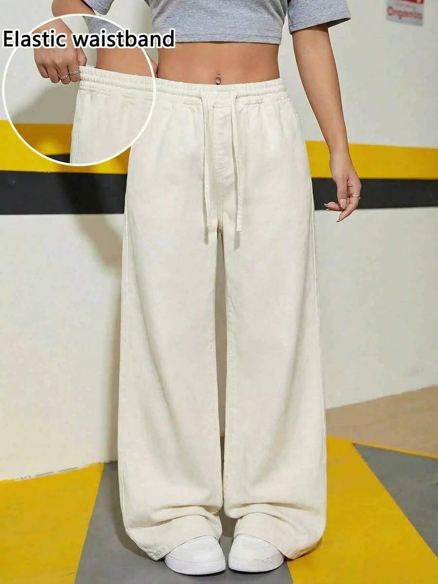 SHEIN Thời trang nữ tuổi teen phong cách thường ngày Y2K vintage cá tính đường phố, quần jean ống rộng thoải mái màu xám, cạp chun co giãn, thiết kế dây rút dành cho nữ sinh trung học. Quần áo nữ tuổi teen mềm mại, trang phục hàng ngày và trang phục mùa đông thu cho nữ sinh, trang phục dự tiệc, trang phục đường phố, quần ống rộng cho nữ. - Màu be - Xem 1