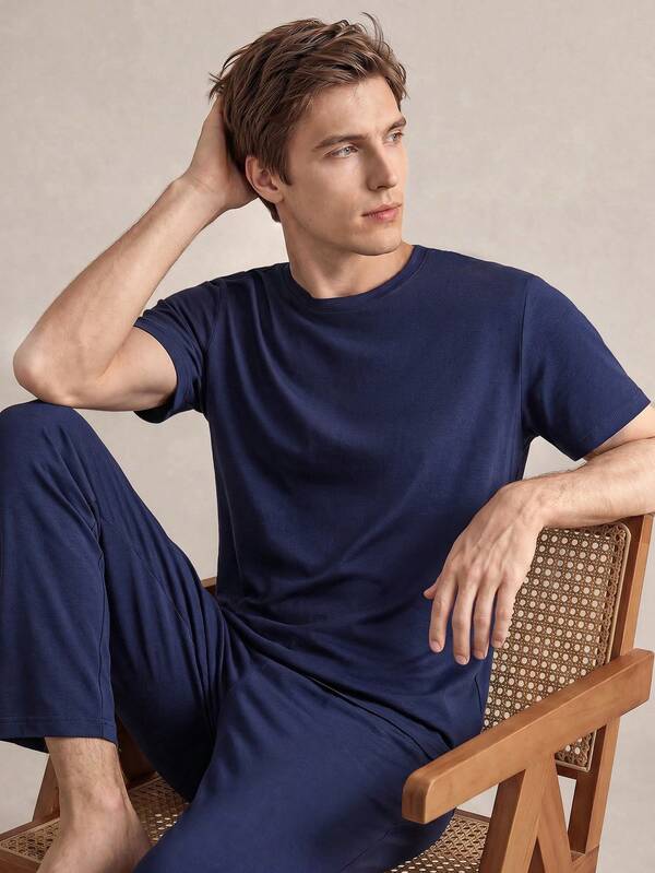 SHEIN Conjunto de pijama de verano para hombres con top de manga corta y cuello redondo de unicolor y pantalones cómodos