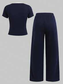 SHEIN Bộ đồ thời trang xuân/hè dành cho nữ tuổi teen, kiểu dáng tối giản, gồm áo thun trắng in họa tiết và quần dệt kim kẻ sọc hoa đen trắng, đa năng cho các dịp thường nhật, đi học, nghỉ mát. - Đen và trắng - Xem 3