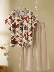 SHEIN Conjunto informal de 2 piezas de top de cuello redondo y pantalones de pierna ancha con estampado de hojas para mujer de talla grande - Albaricoque - Ver 1