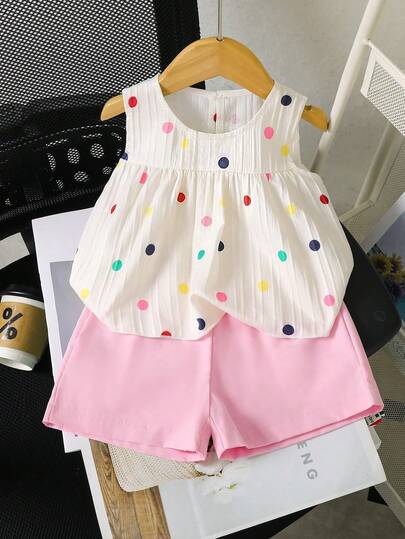 SHEIN Bebek Kız Çocuk İçin Beyaz Düz Renk Jakarlı Dokulu Yuvarlak Yaka Kolsuz Kısa Pileli Üst, Renkli Puantiyeli Baskılı, Rahat Pembe Lastikli Bel Şort ile Kombine Edilmiş, Tatil İçin Rahat Fransız Pastoral Şık Kıyafet İlkbahar/Yaz Kız Çocuk Yazlık Kıyafet Takımları Bebek Kız Çocuk Yazlık Kıyafet Takımları Bebek Kız Çocuk Yazlık Kıyafet Takımları