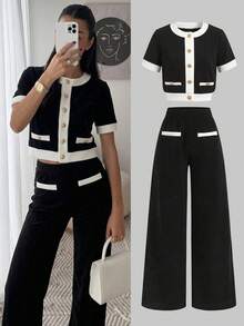 SHEIN Bộ đồ thể thao cho nữ tuổi teen, kiểu dáng thường ngày nhưng vẫn thanh lịch, thích hợp đi học. Áo và quần ống đứng phối màu đen trắng tương phản, gồm áo và quần ống đứng. - Đen và trắng - Xem 1