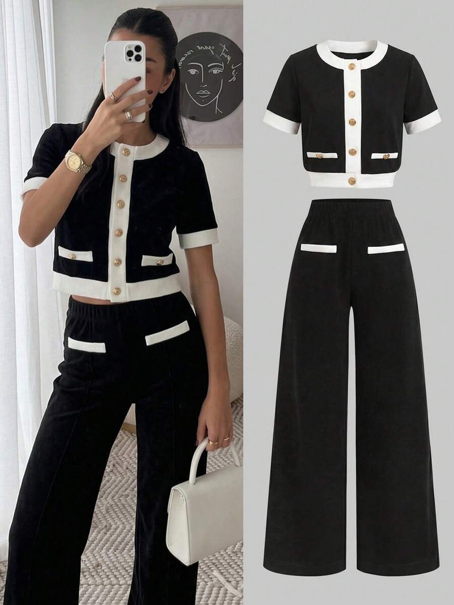 SHEIN Bộ đồ thể thao cho nữ tuổi teen, kiểu dáng thường ngày nhưng vẫn thanh lịch, thích hợp đi học. Áo và quần ống đứng phối màu đen trắng tương phản, gồm áo và quần ống đứng. - Đen và trắng - Xem 1