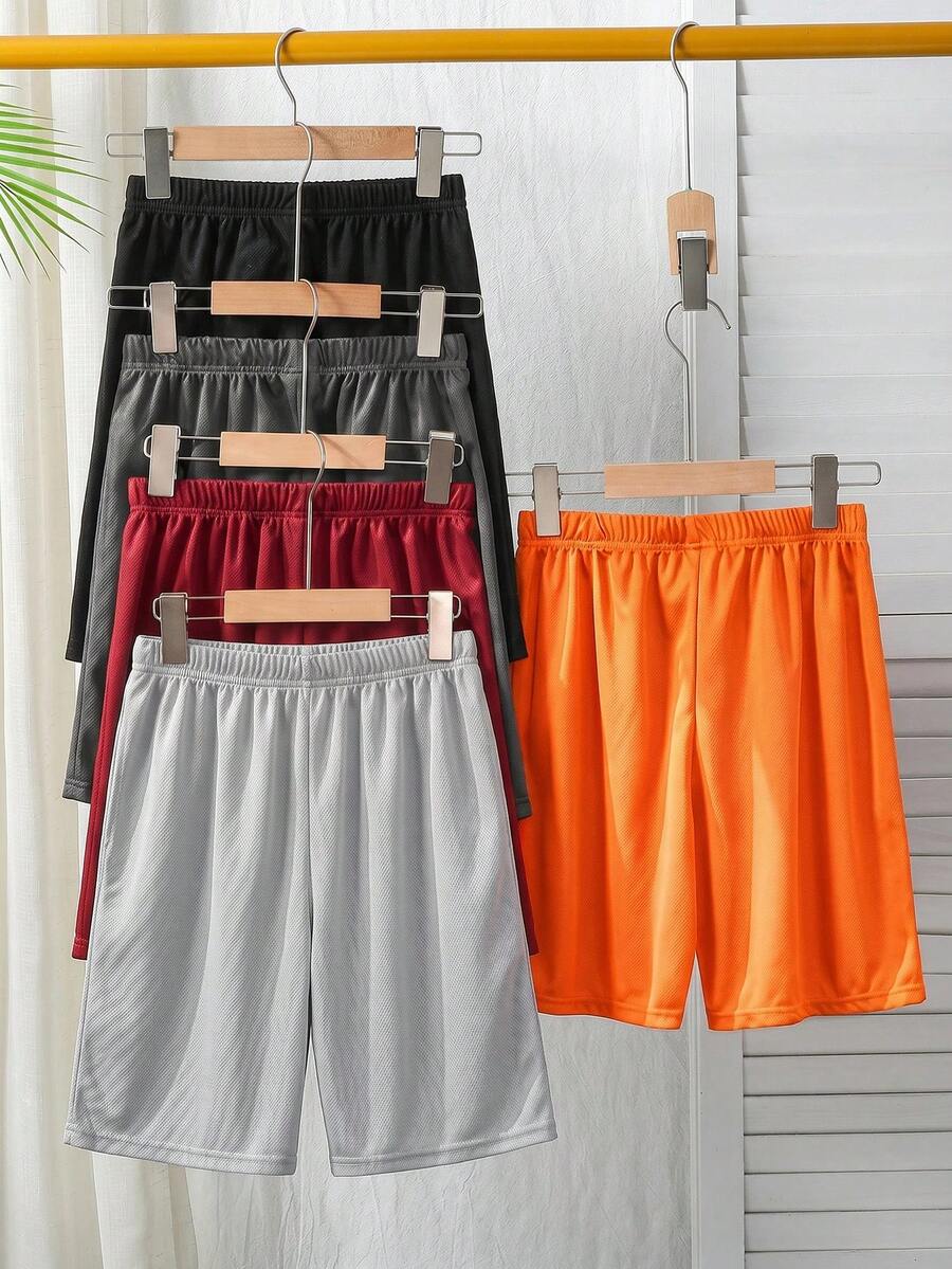 SHEIN Bộ 5 chiếc quần short thể thao dáng rộng, màu trơn, chất liệu lưới, dành cho bé trai tuổi teen, nhiều màu. - trái cam - Xem 1