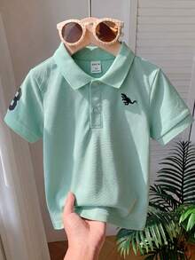 SHEIN Young Boy Short Sleeve Dinosaur Print Casual Polo Shirt, Great For Getaways, Holidays, Travel, Relaxation, And Sunbathing In The Summer - Green - View 3