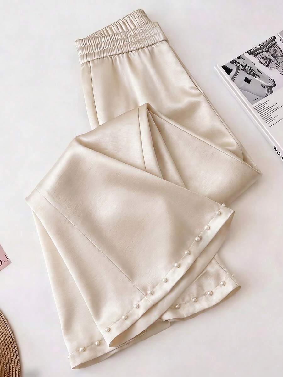 Elegantrix Calça pantalona de cetim com detalhes em pérola, ideal para encontros casuais, festas e para o dia a dia, perfeita para a primavera/verão. - Damasco - Ver 1
