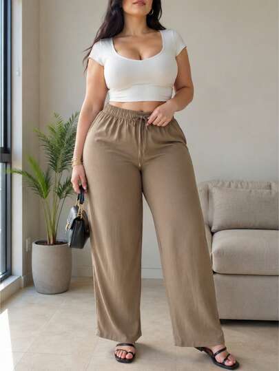 Pantalón de pierna ancha para mujer, casual y elegante. Tela de viscosa y nailon, apto para temporadas de primavera y verano, ajuste de cintura natural con resorte ligero, cordón decorativo no ajustable. Sin bolsillos. Textura lisa sin estampados. Interior muy fresco y ligero con tu piel.