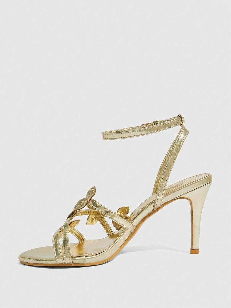 CUCCOO SZL Women's Metallic Leaf Decor Criss-Cross Strap Round Toe Stiletto High Heel Sandals, Luxurious Glossy Gold Finish, Elegant Party/Date/Evening Wear For Summer