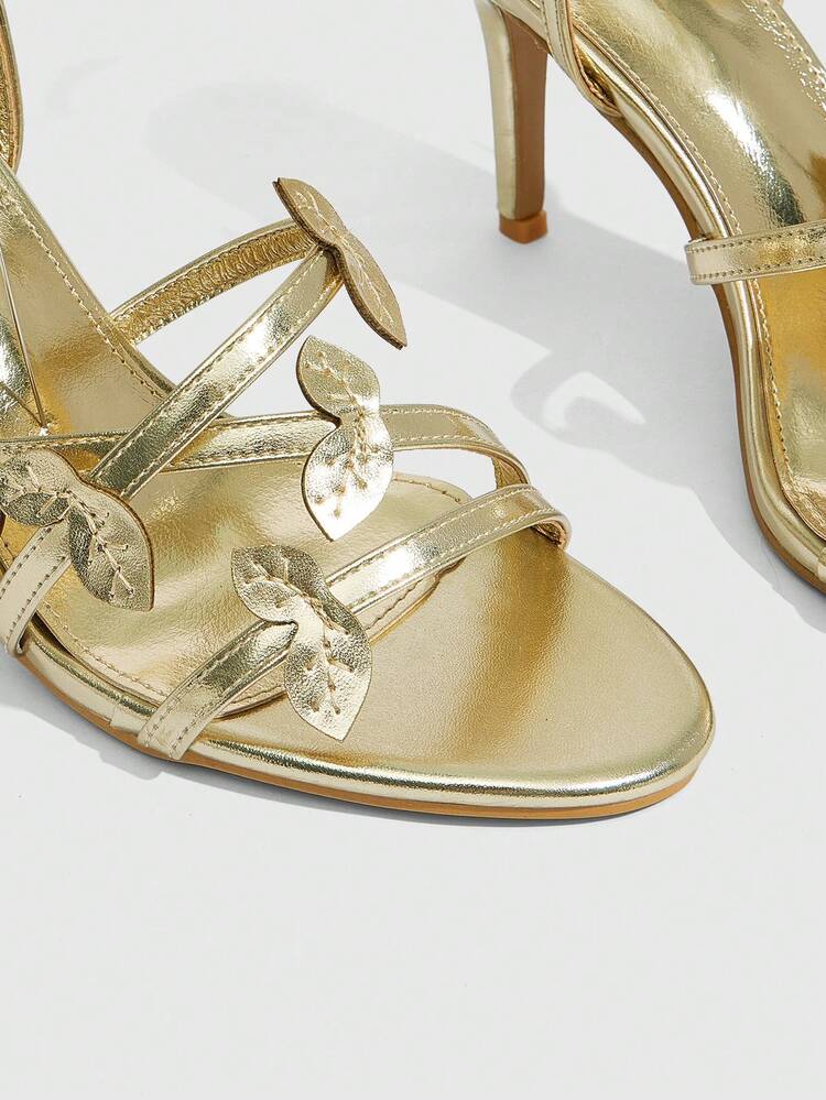 CUCCOO SZL Women's Metallic Leaf Decor Criss-Cross Strap Round Toe Stiletto High Heel Sandals, Luxurious Glossy Gold Finish, Elegant Party/Date/Evening Wear For Summer